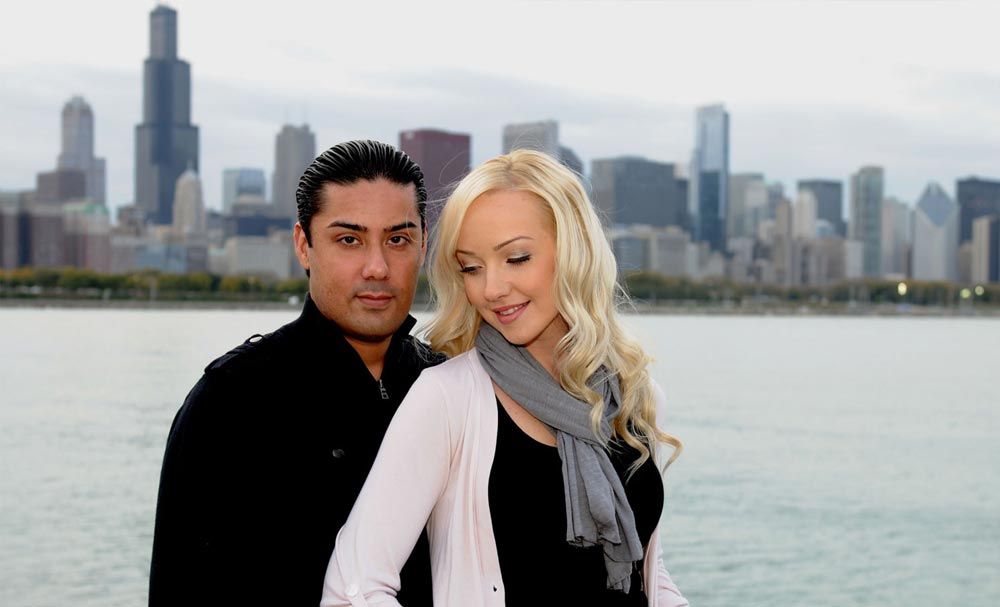 Couple portrait beside the waterfront