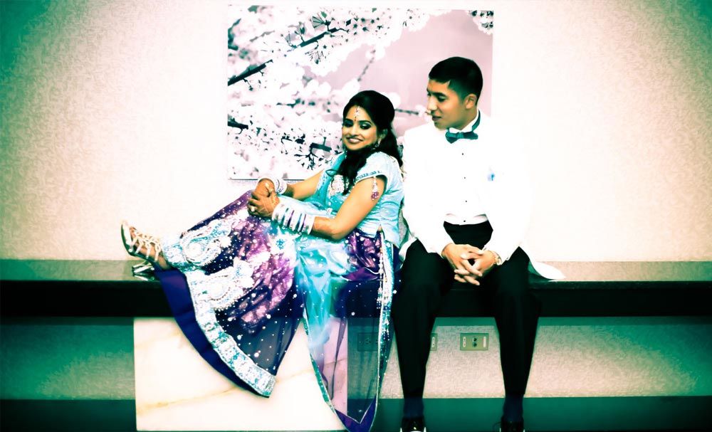 Couple seated together in colorful formal attire