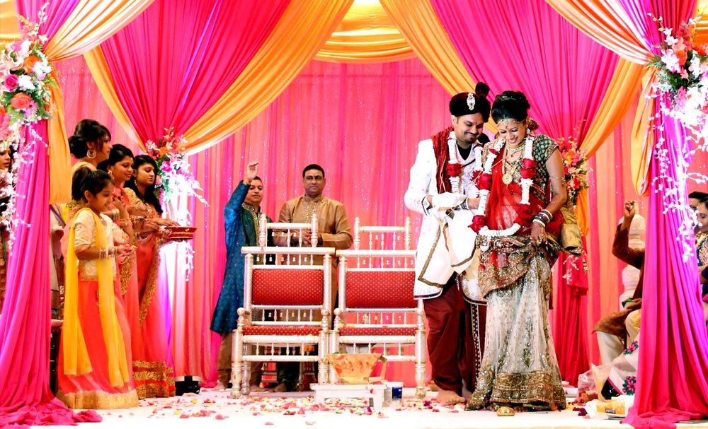 Bride and groom surrounded by family during the ceremony