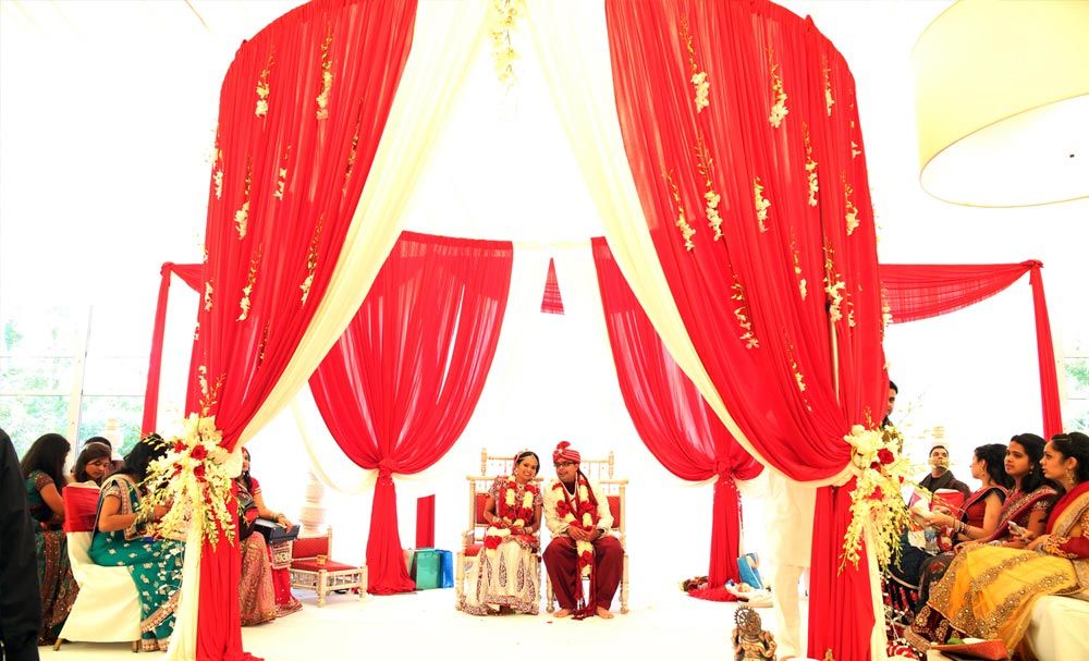 Red and white wedding ceremony canopy