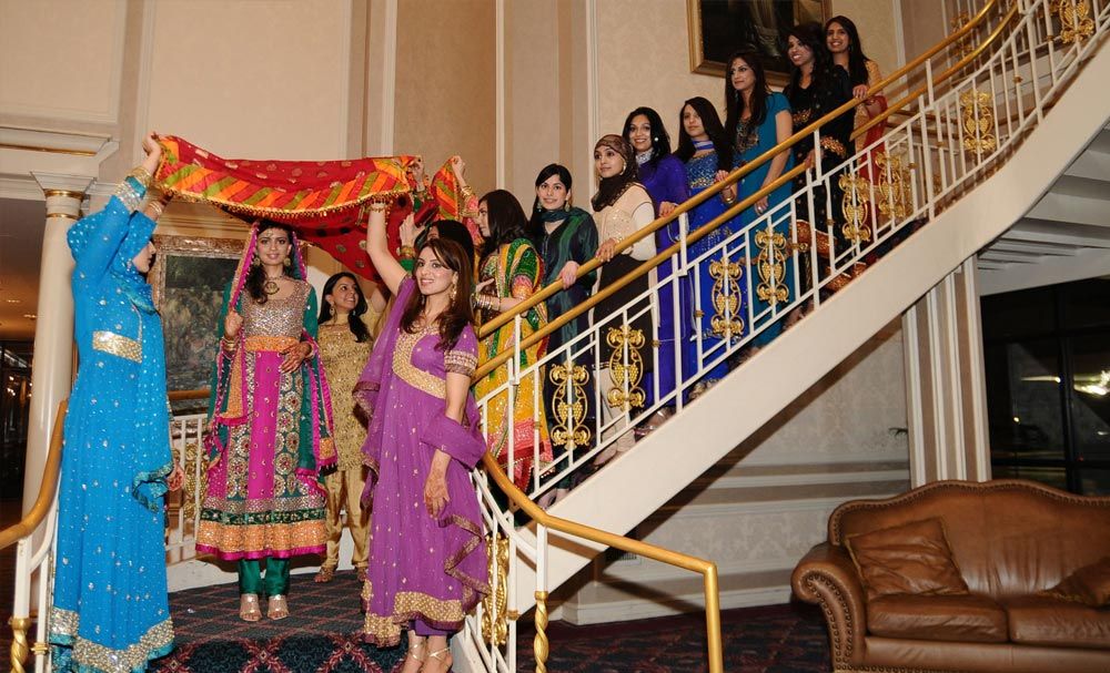 Wedding party gathered on an ornate staircase