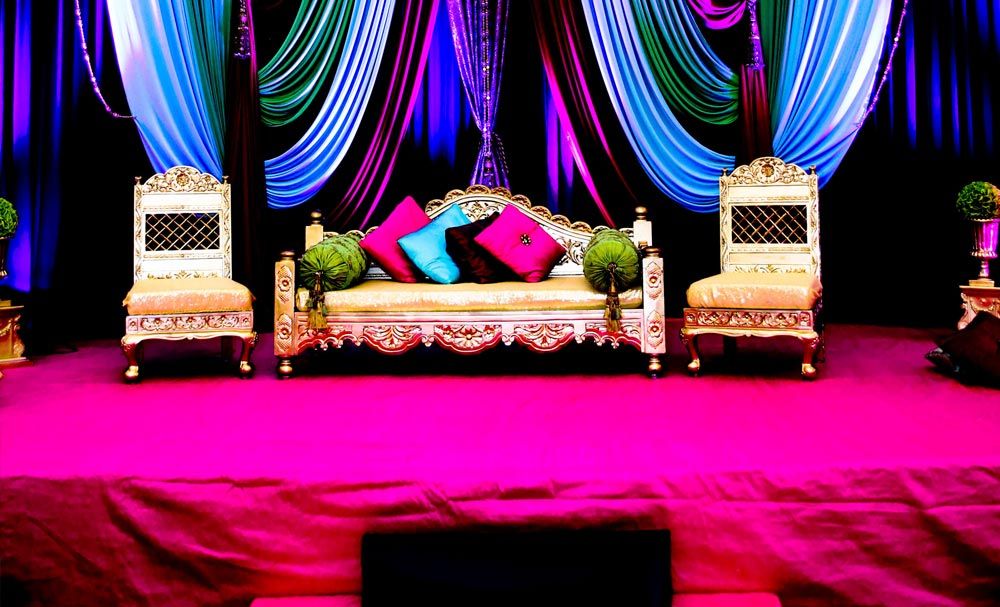 Colorful wedding stage with ornate seating