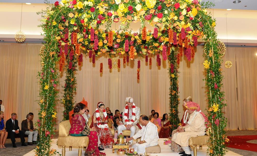 Floral wedding canopy during a traditional ceremony