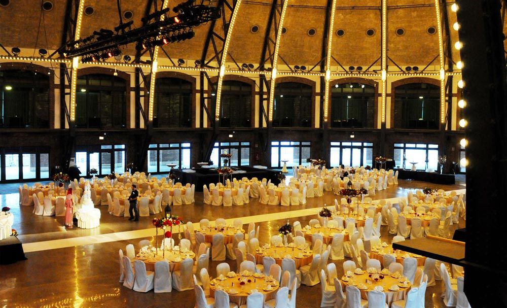 Reception tables arranged inside a grand hall