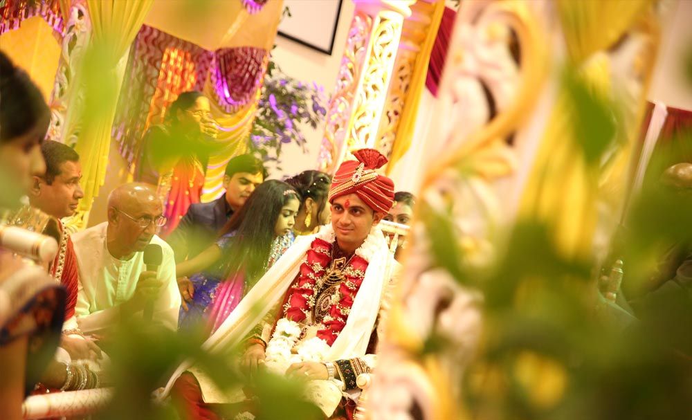 Close view of a bride and groom during a family ceremony